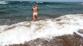 FIRST TIME AT A NUDIST BEACH, SMOKING A CIGARETTE AND MASTURBATING HER PUSSY